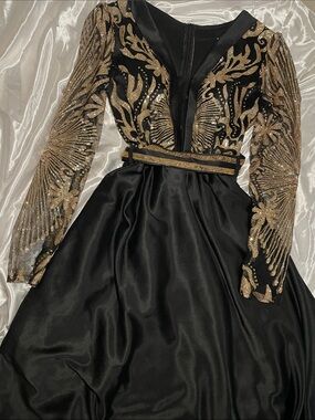 Elegant Black Long-Sleeve Evening Dress with Gold Embellishment